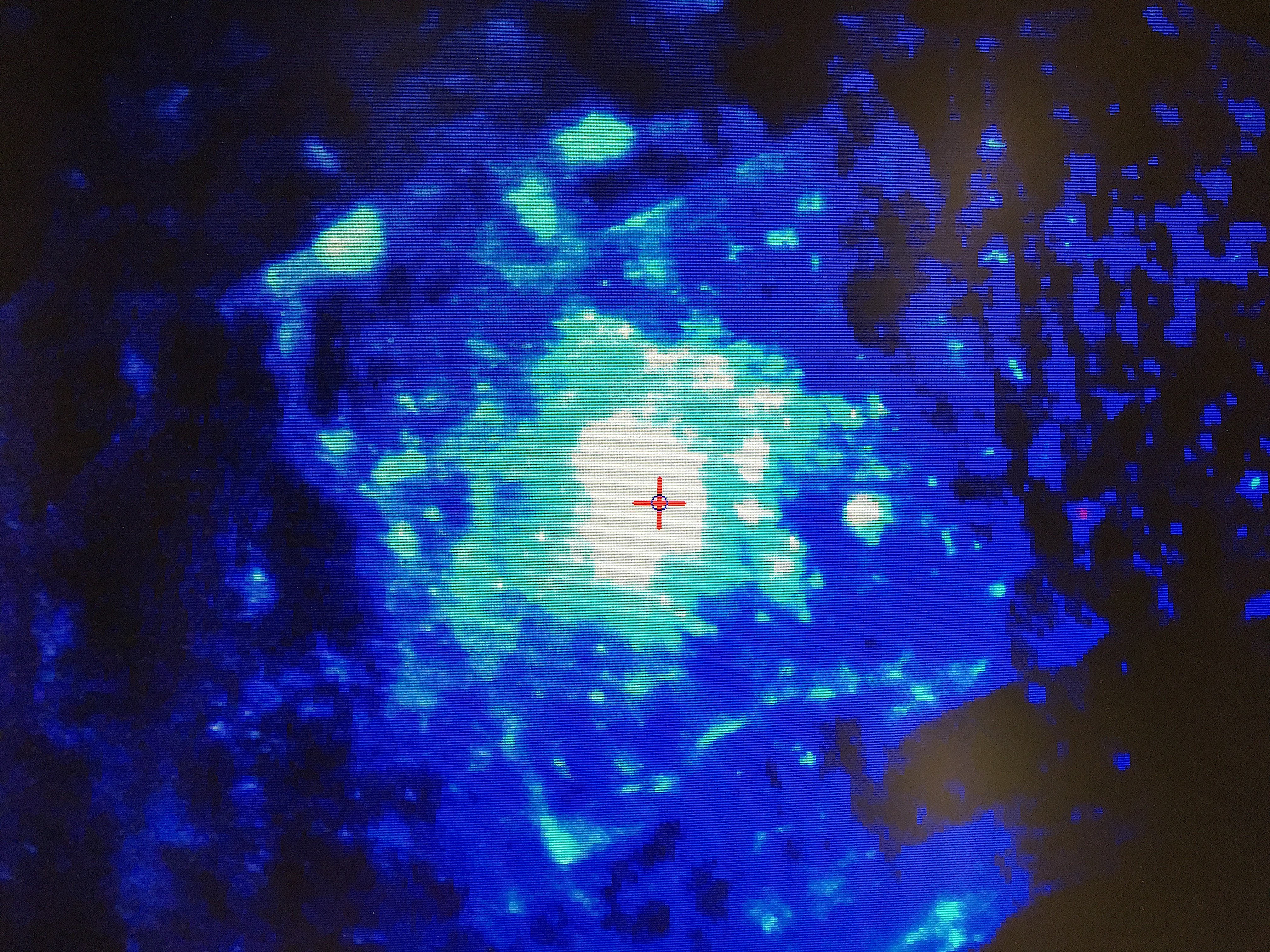 photograph of Cameca SX100 monitor showing bright blue-white cathodoluminescence of pabstite, 299 nA beam current, from Kalkar quarry, California