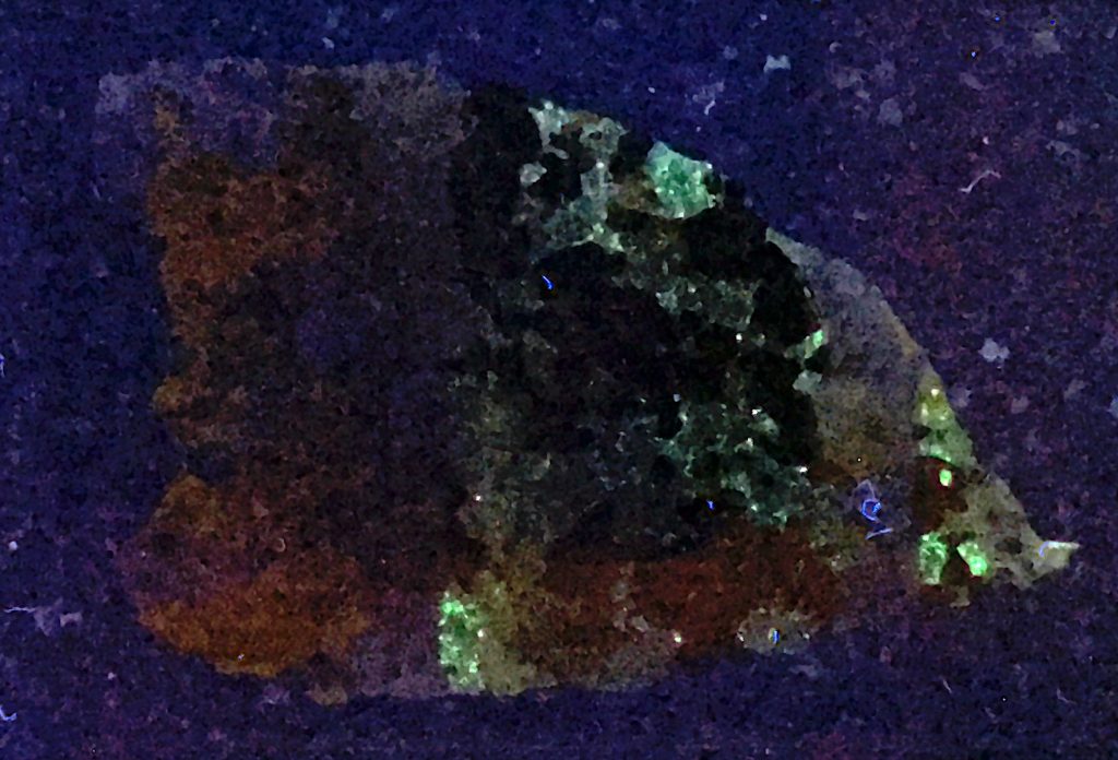 Franklin minerals in thin section under UV light